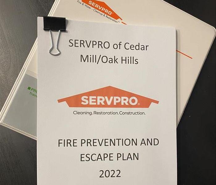 packet of paper on a desk showing a fire response plan